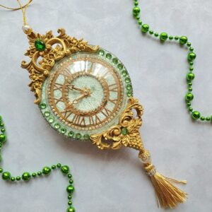 Mint green velvet Christmas clock ornament with gold detailing, rhinestones, and golden tassel