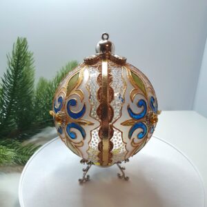 Reverse side of a blue and golden hand-painted Christmas ornament