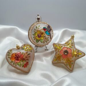 Handmade stained glass Christmas ornaments in three different shapes