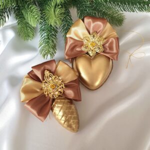 Turquoise and pink Christmas baubles with gold decorative details