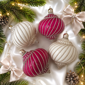 Raspberry pink and white spinning-top Christmas ornaments with sparkling rhinestone chains